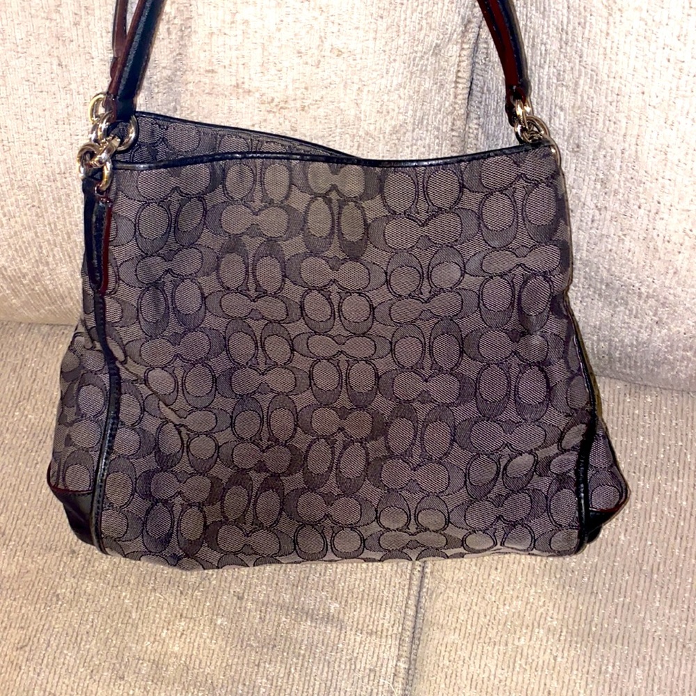 Vintage authentic coach bag with three large separate pockets with zipper access